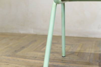green metal dining chair