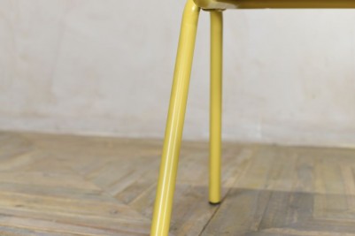 yellow metal dining chair