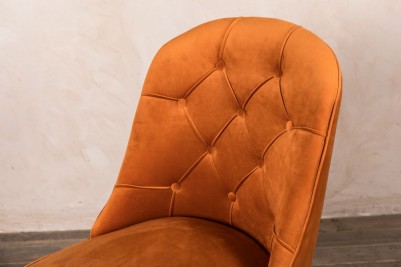 velvet dining chair in burnt orange