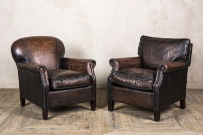 pair of vintage brown leather armchairs