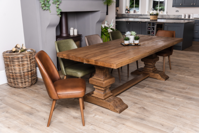 Theron Leather Dining Chairs Around a Table