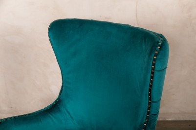 teal button back chair