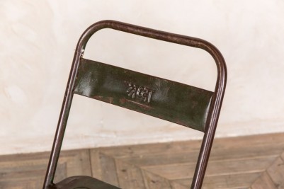 green metal folding chair