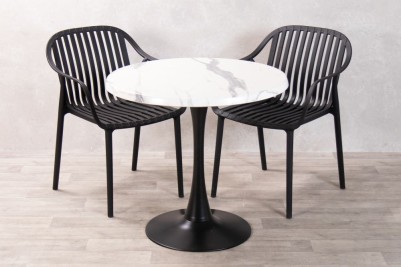 white-marble-table-with-black-california-chairs