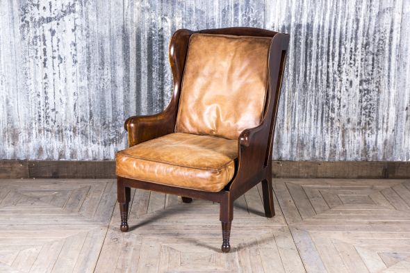 tan and grey high back wing armchair